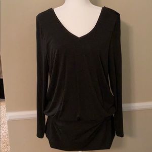 Long T-shirt gathers at bottom. Beads at V neck